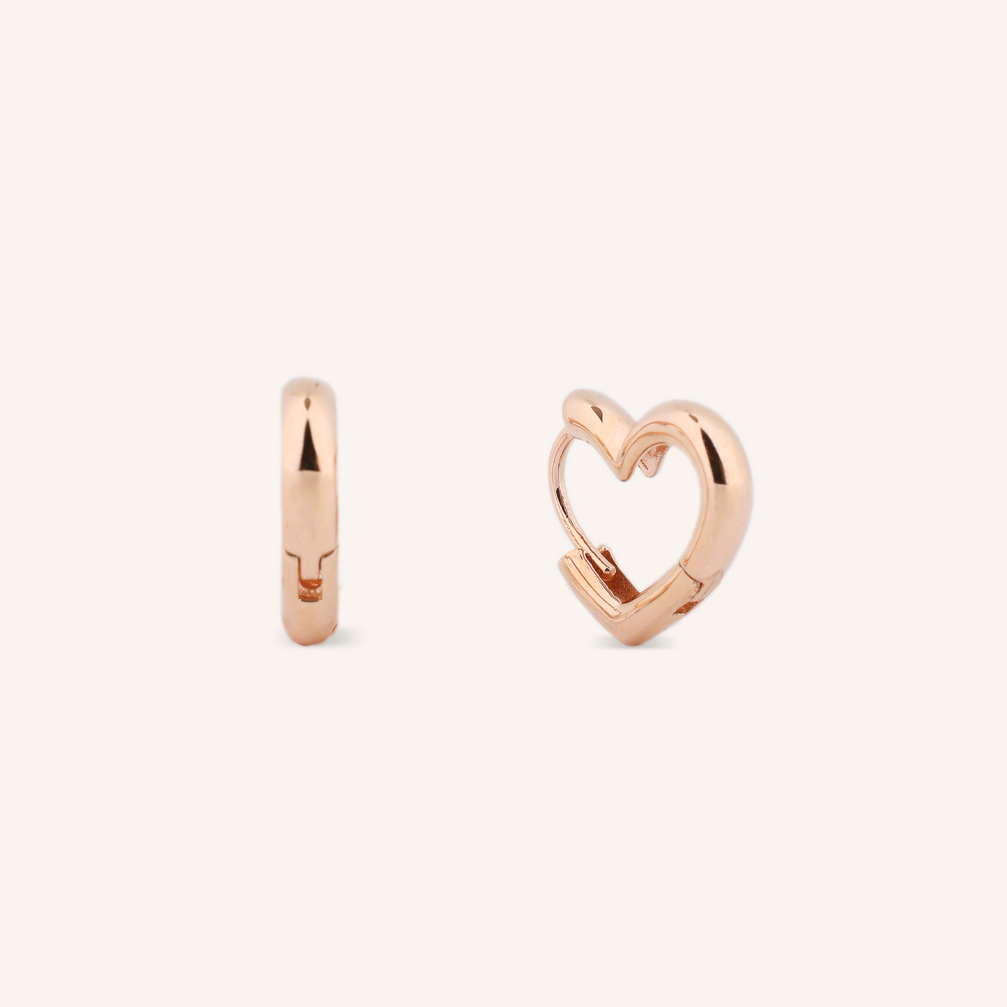 Rose gold hoop earrings on a white background