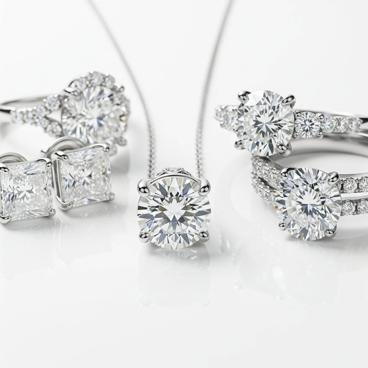 Diamond jewelry set including earrings and a ring on a white background
