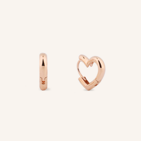 Rose gold hoop earrings on a white background